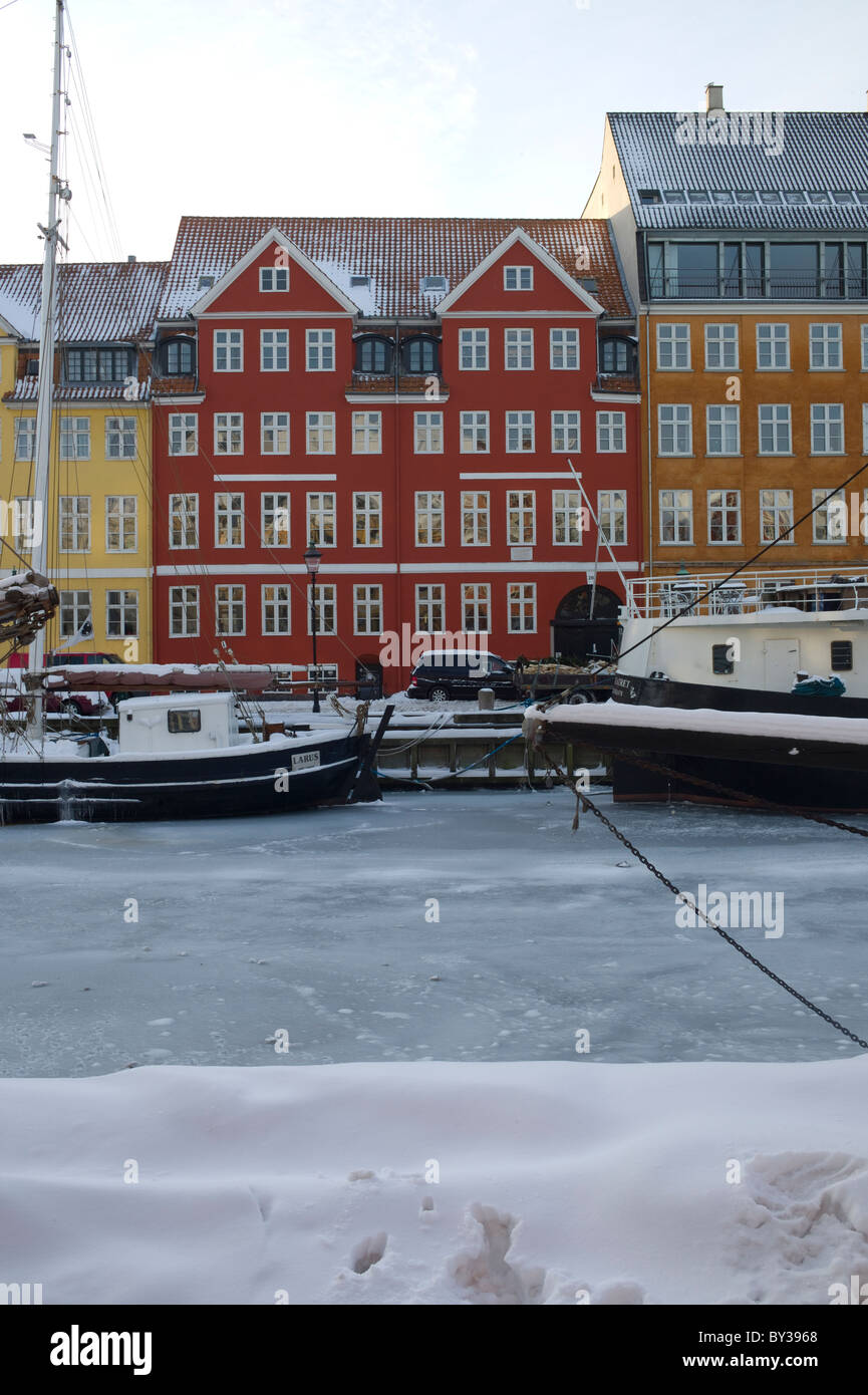 Frozen canal/sea at Nyhavn, (New Harbour) Copenhagen, Denmark at Christmastime Stock Photo