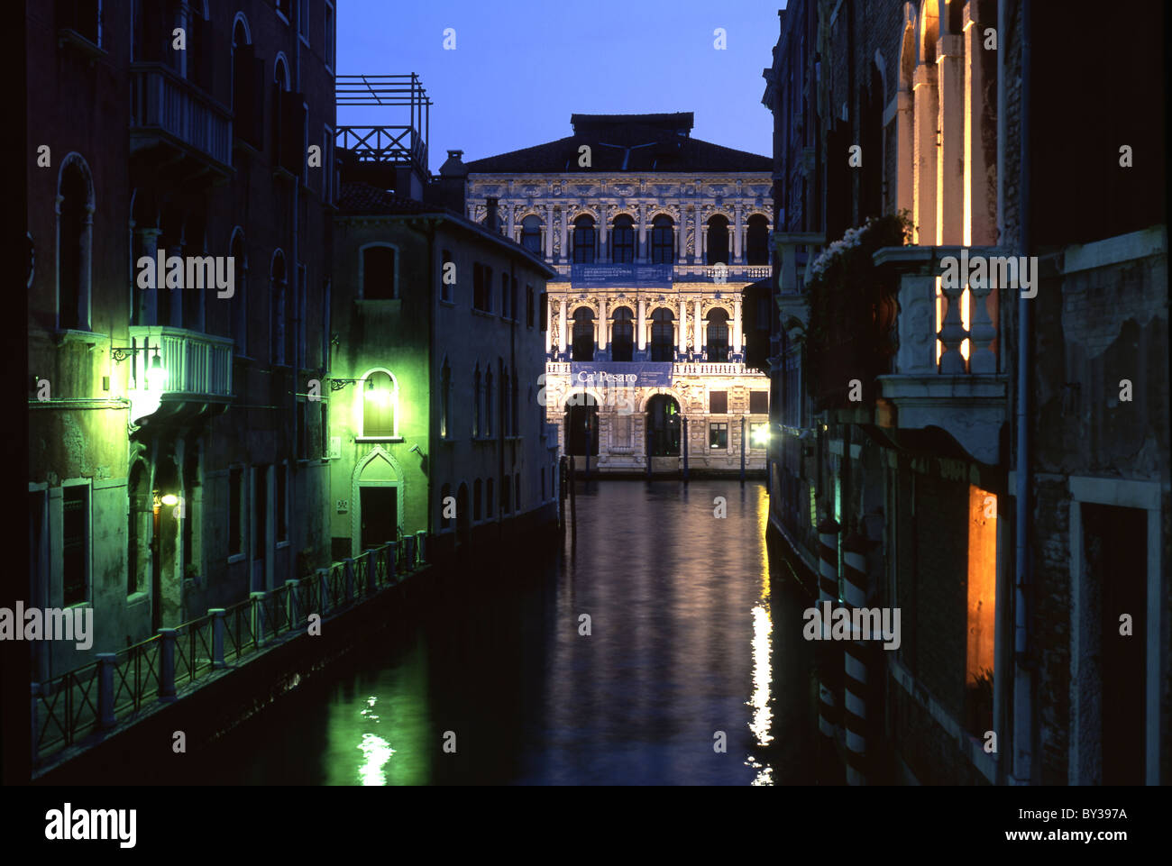 Ca' Pesaro at night seen down Rio di Noale Grand Canal Santa Croce sestier Venice Veneto Italy Stock Photo