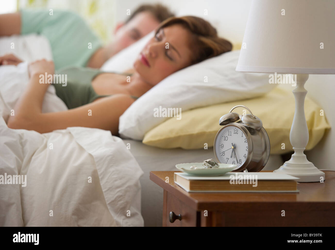 USA, New Jersey, Jersey City, Young couple sleeping in bed Stock Photo