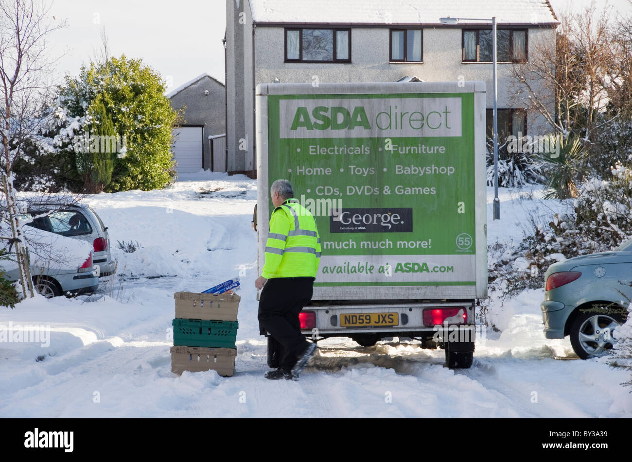 UK, Britain. Asda home delivery van and man outside a house delivering
