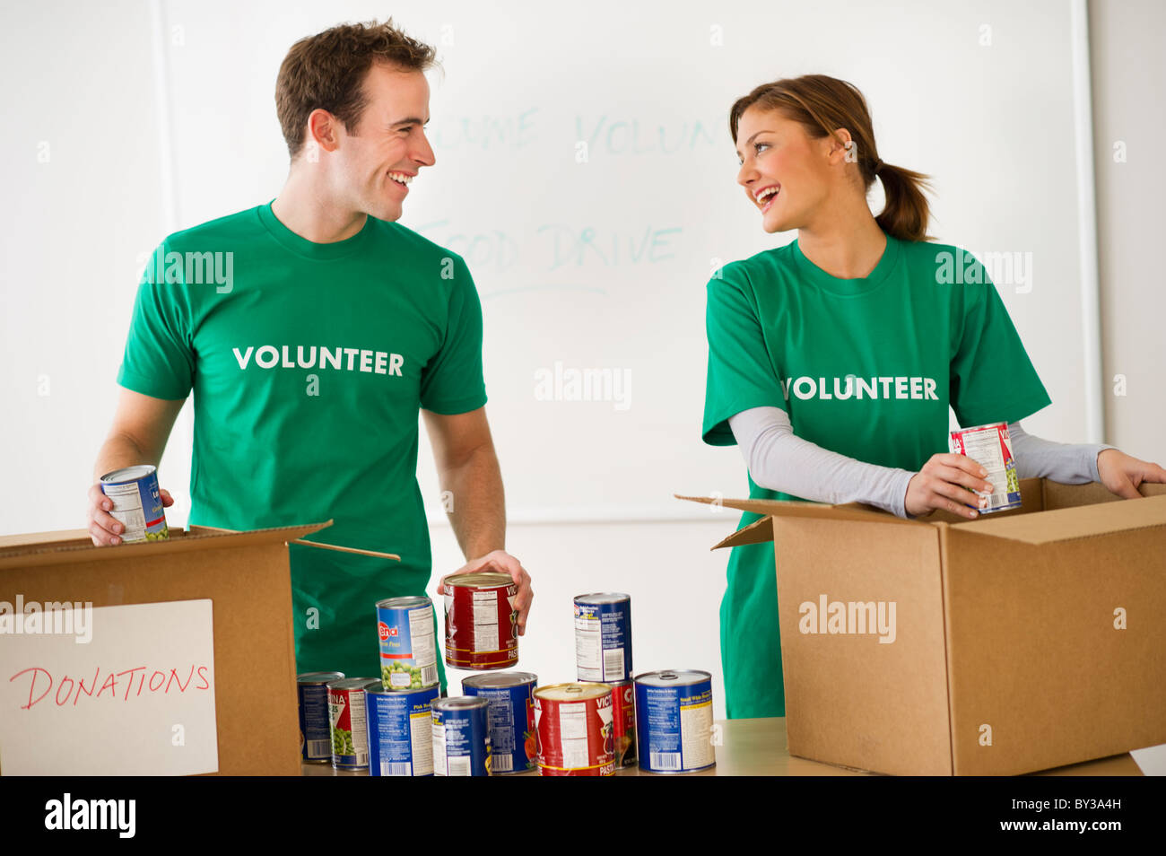 USA, New Jersey, Jersey City, Two young people as volunteers Stock Photo