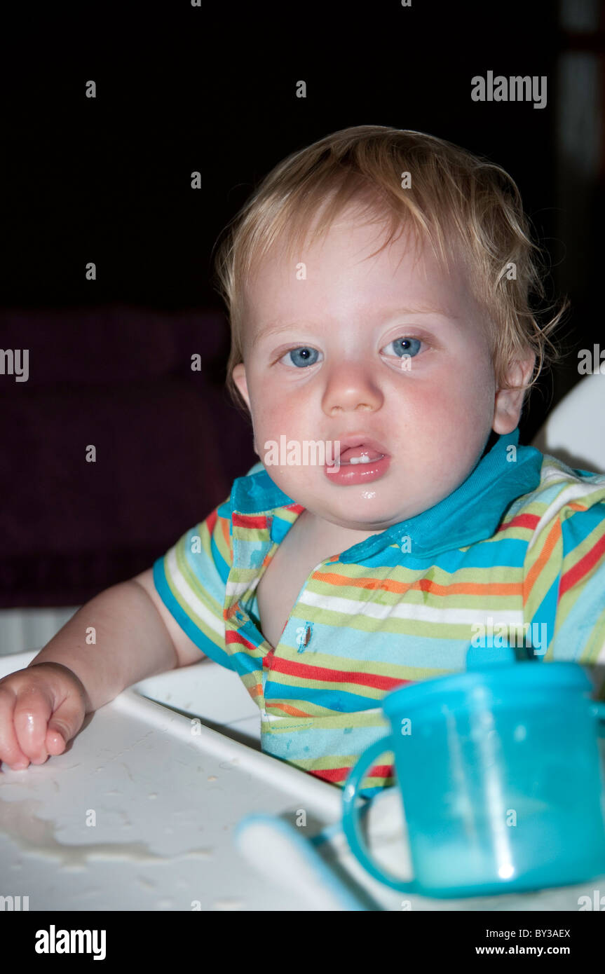 Toddler with drinking beaker Stock Photo Alamy