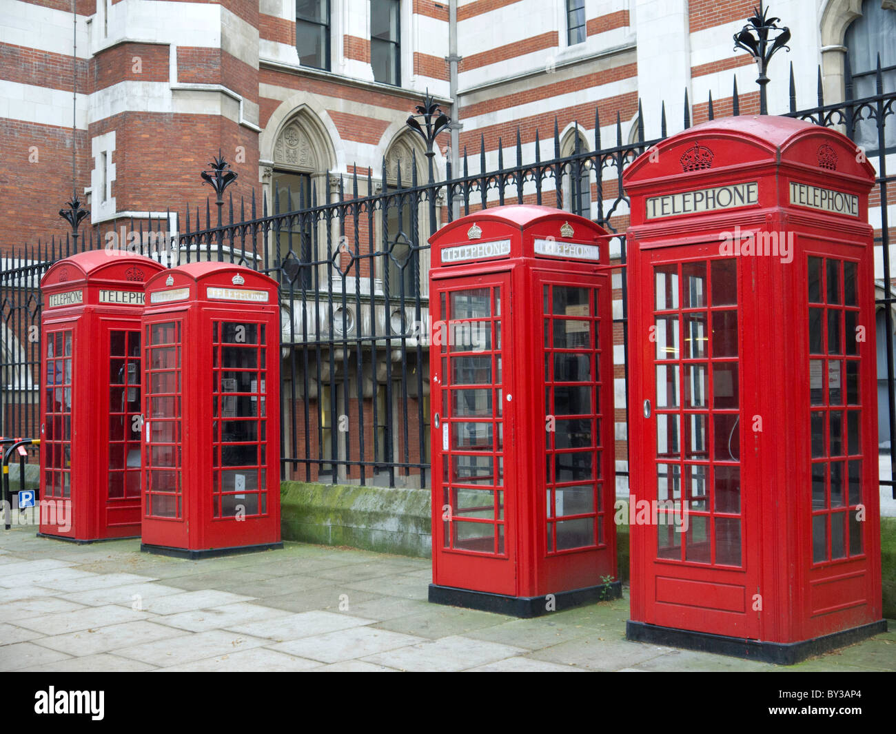 A row of traditional red telephone boxes in Carey Street, behind the Royal Courts of Justice, in London. Stock Photo