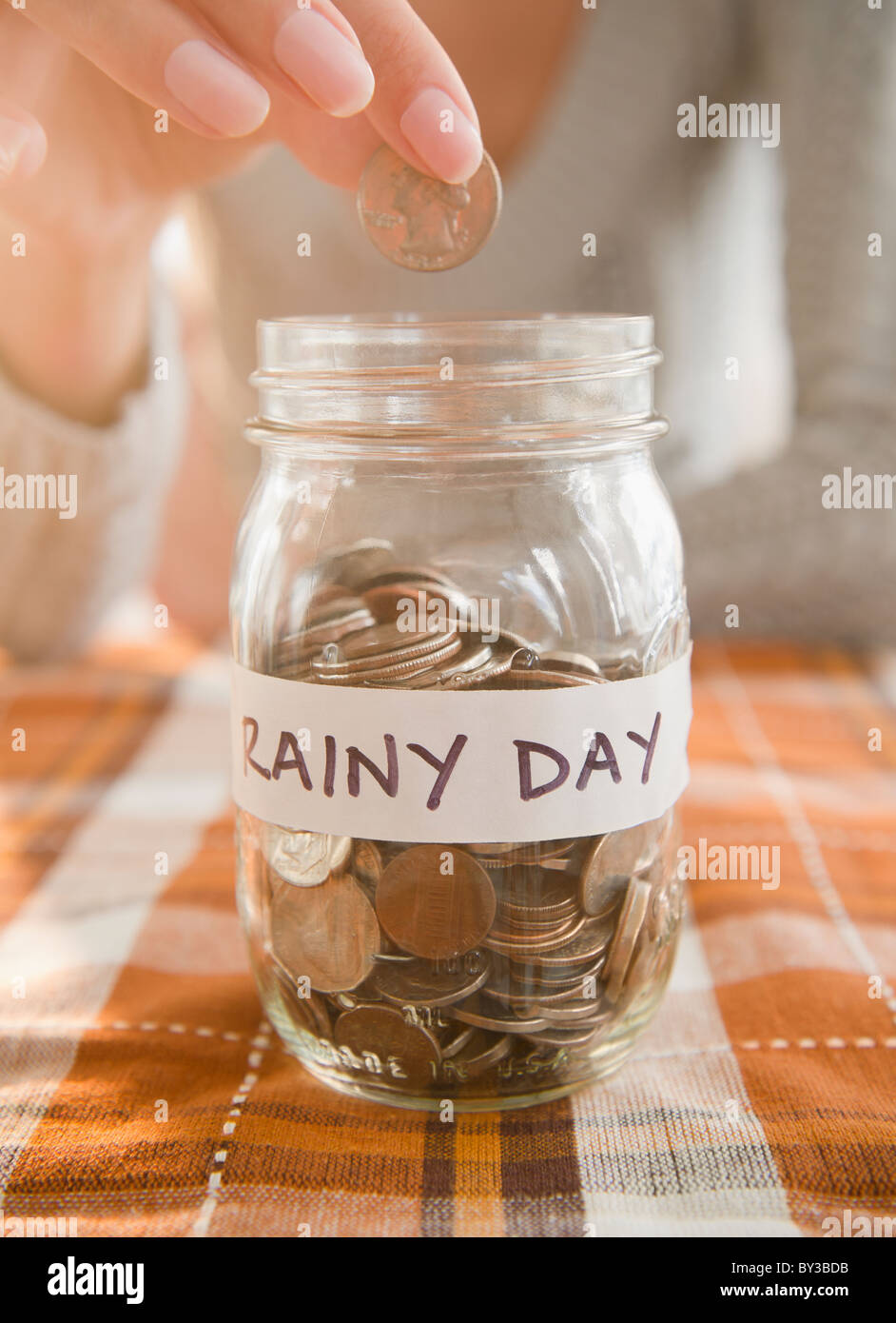 USA, New Jersey, Jersey City, Saving up for rainy day Stock Photo