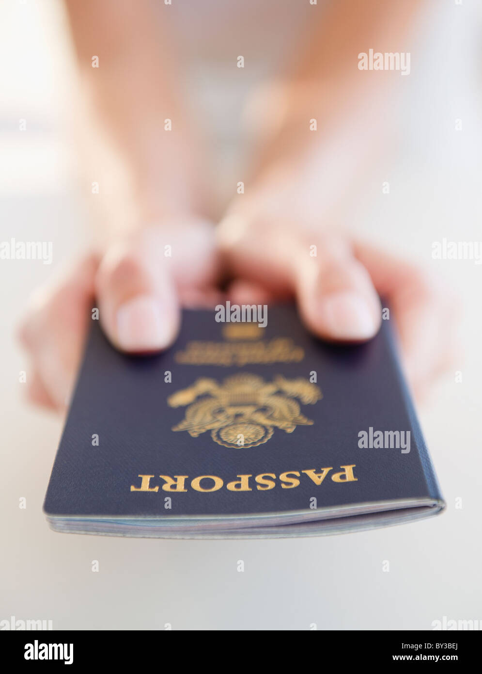 USA, New Jersey, Jersey City, Close-up view of woman's hands holding US passport Stock Photo