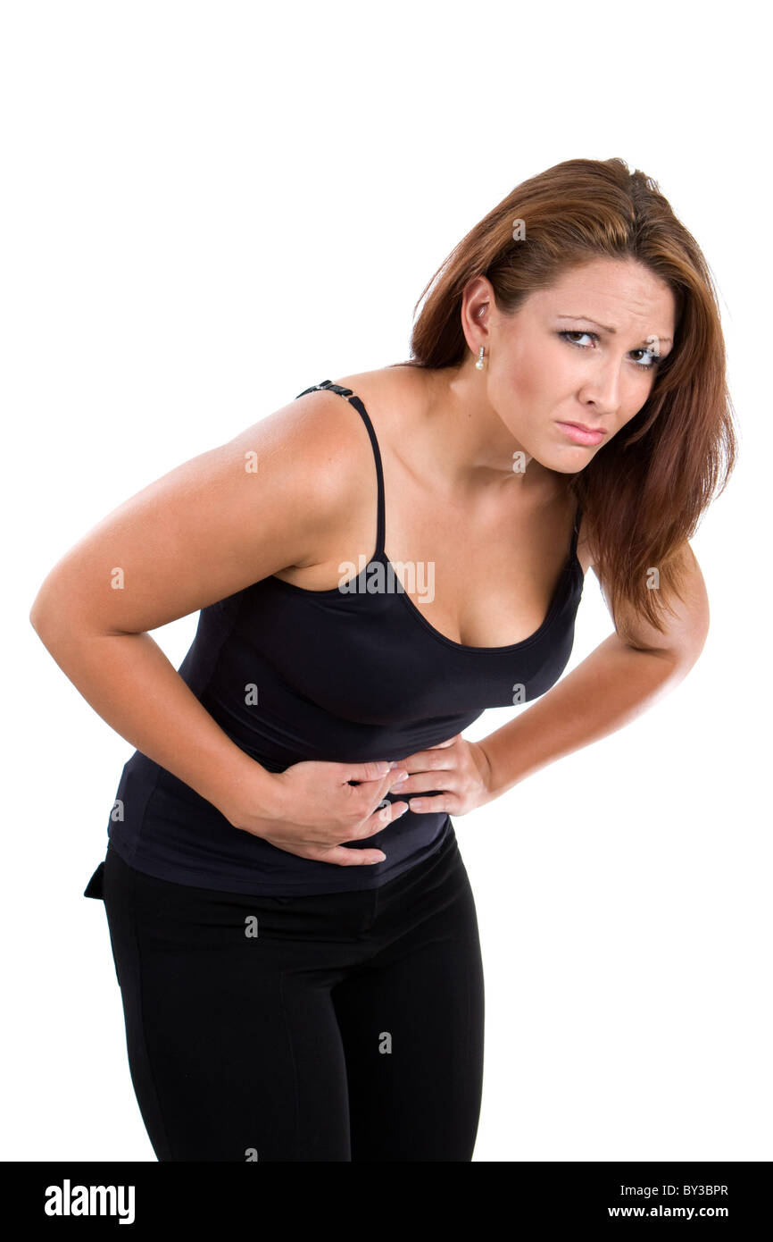 Woman bends over with stomach cramps. Stock Photo