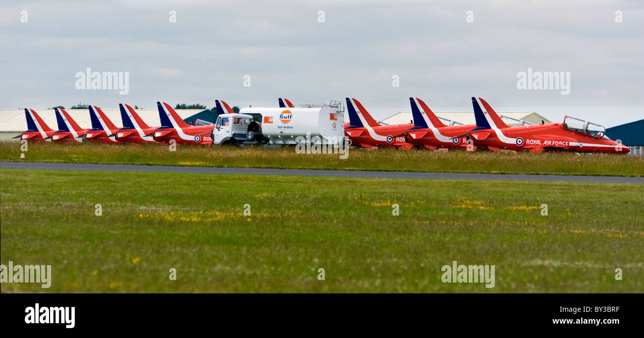 The RAF Red Arrows Aerobatic Teams BAE Hawk T1A aircraft on the ground being refueled during an air show in the UK. Stock Photo
