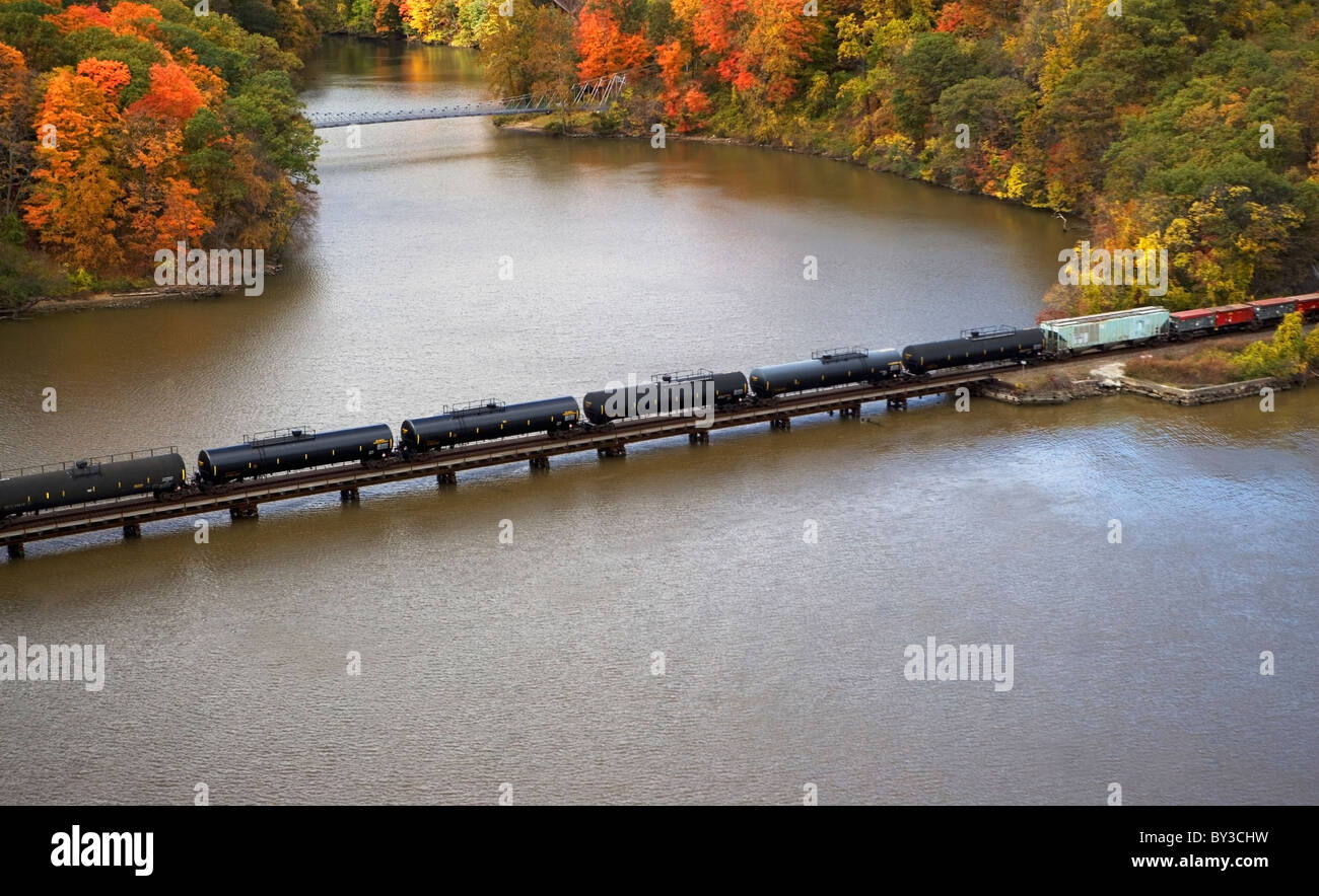 USA, New York, Bear Mountain, aerial view of train crossing lake Stock Photo