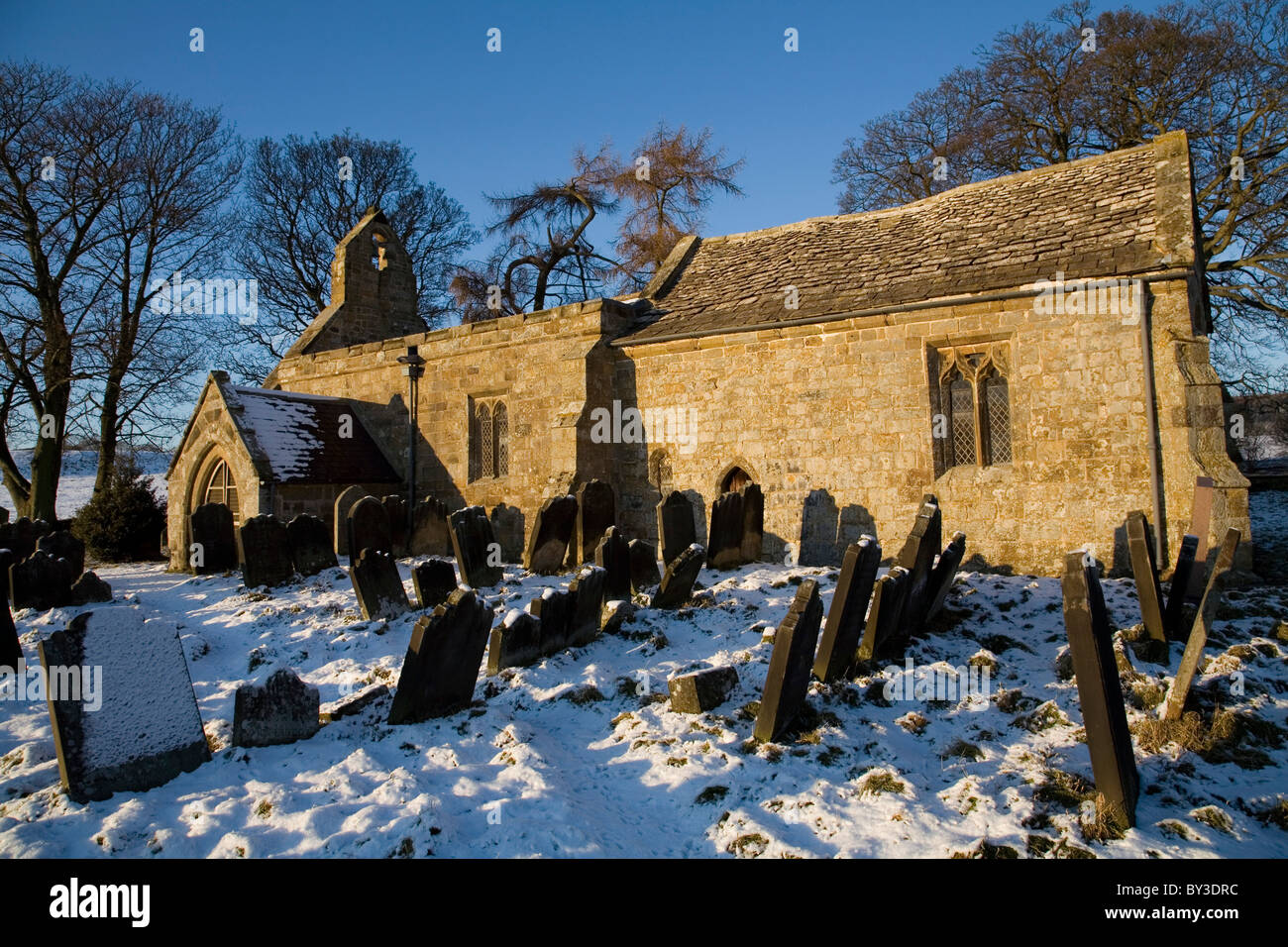 Graveyard of St Mary Magdalene Church in Winter near Over Silton Village North Yorkshire England Stock Photo