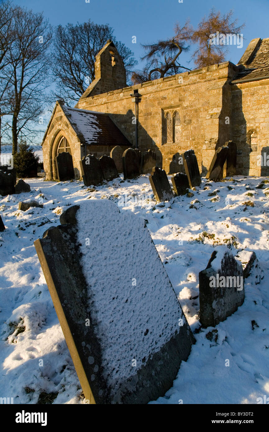 Graveyard of St Mary Magdalene Church in Winter near Over Silton Village North Yorkshire England Stock Photo