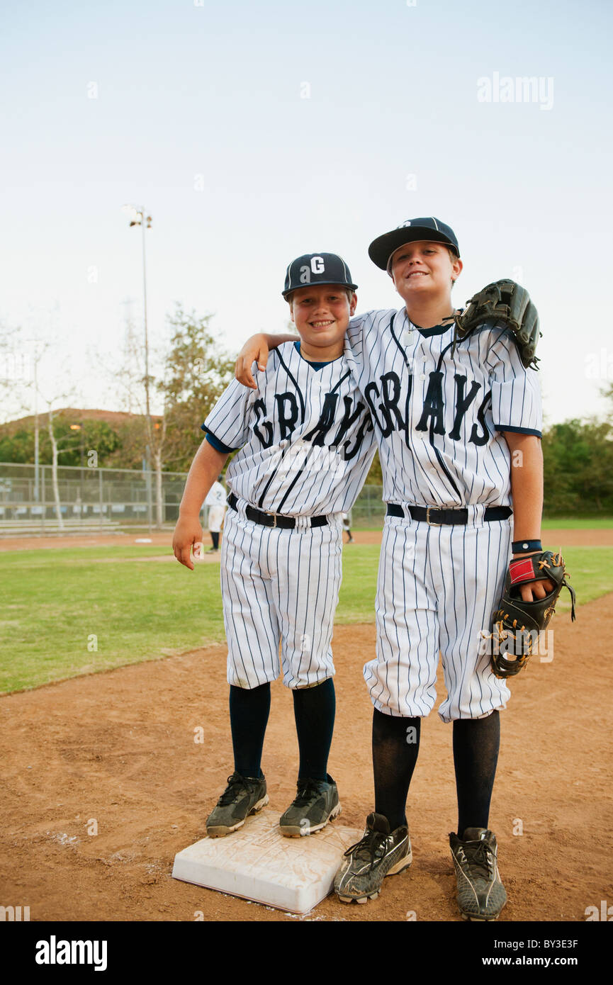 USA, California, Ladera Ranch, two boys (10-11) in baseball uniforms Stock Photo
