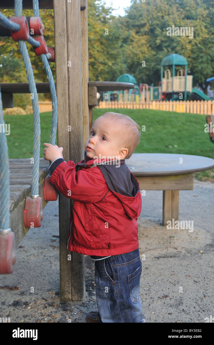 A little one year old boy playing at playground Stock Photo - Alamy