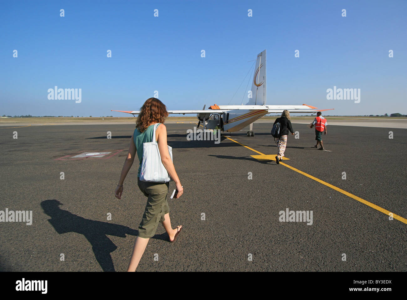Woman boarding aeroplane hi-res stock photography and images - Alamy