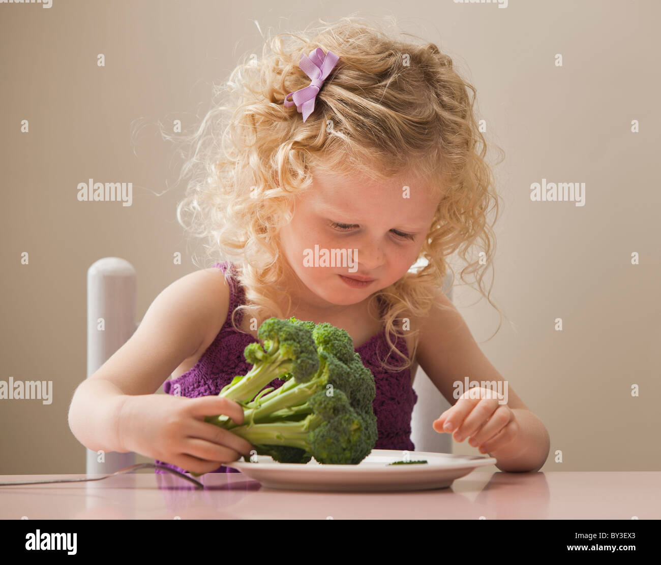 USA, Utah, Lehi, girl (2-3) eating broccoli Stock Photo
