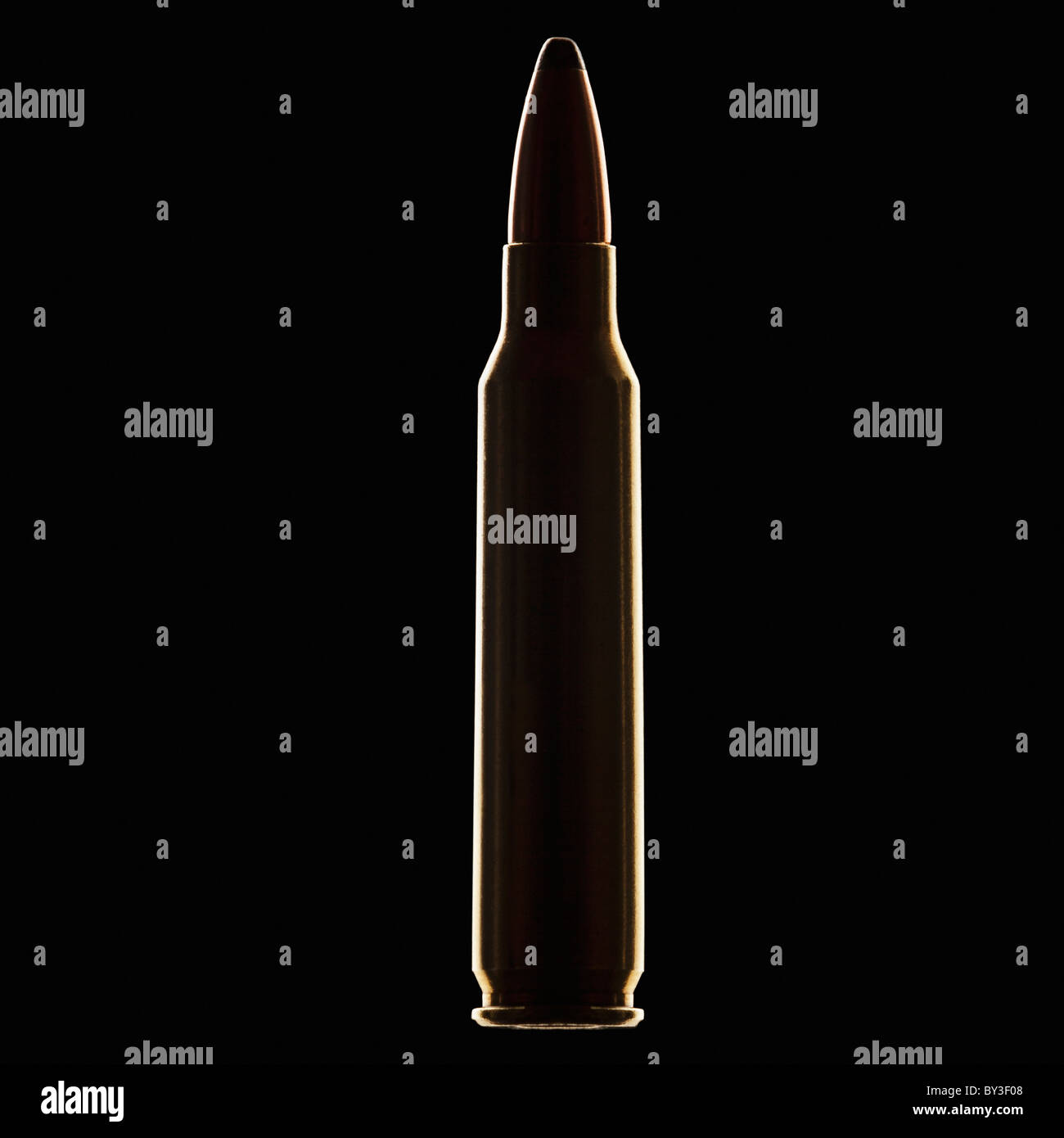 Single bullet on black background, close-up Stock Photo