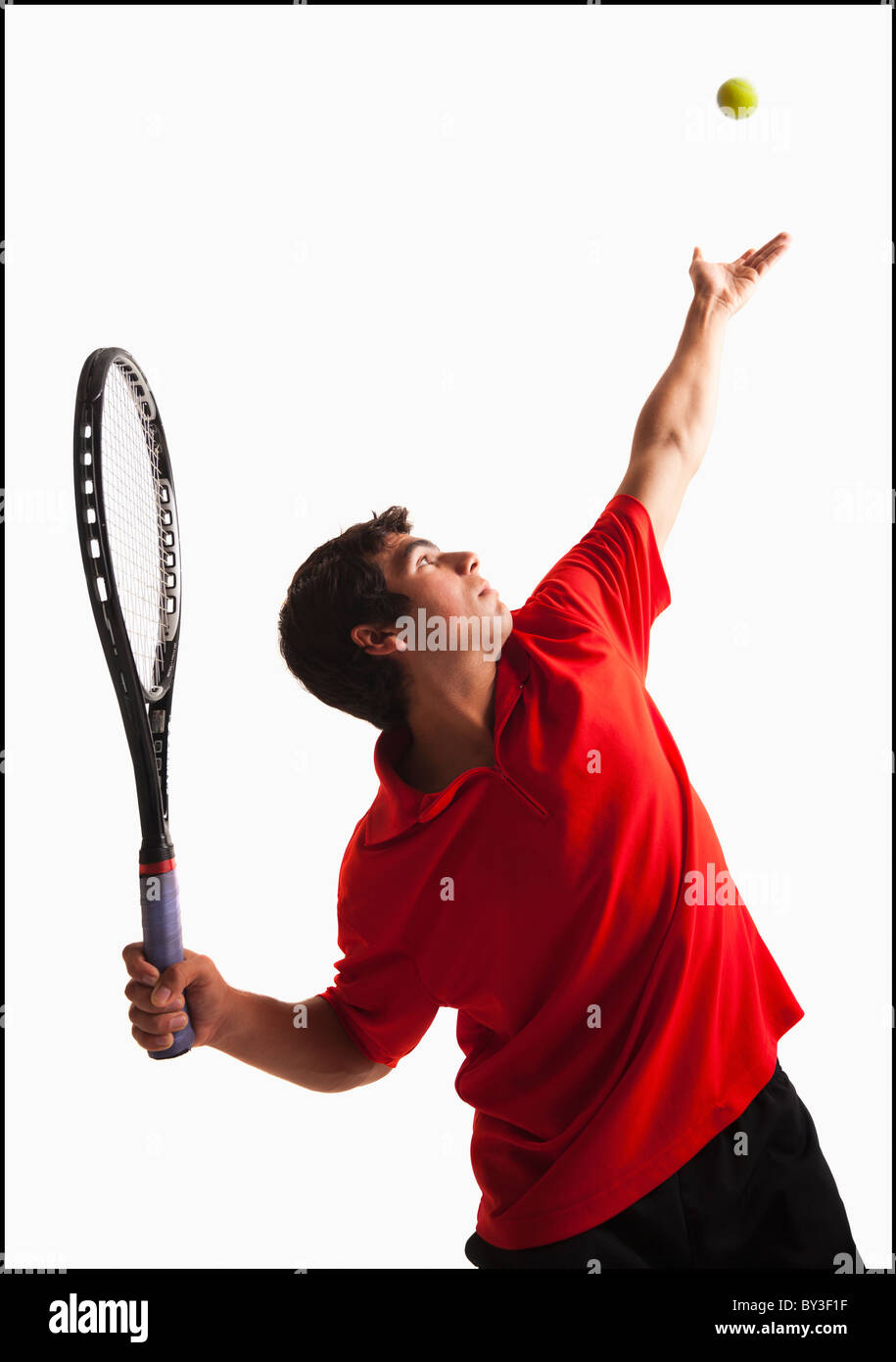 Young man playing tennis Stock Photo