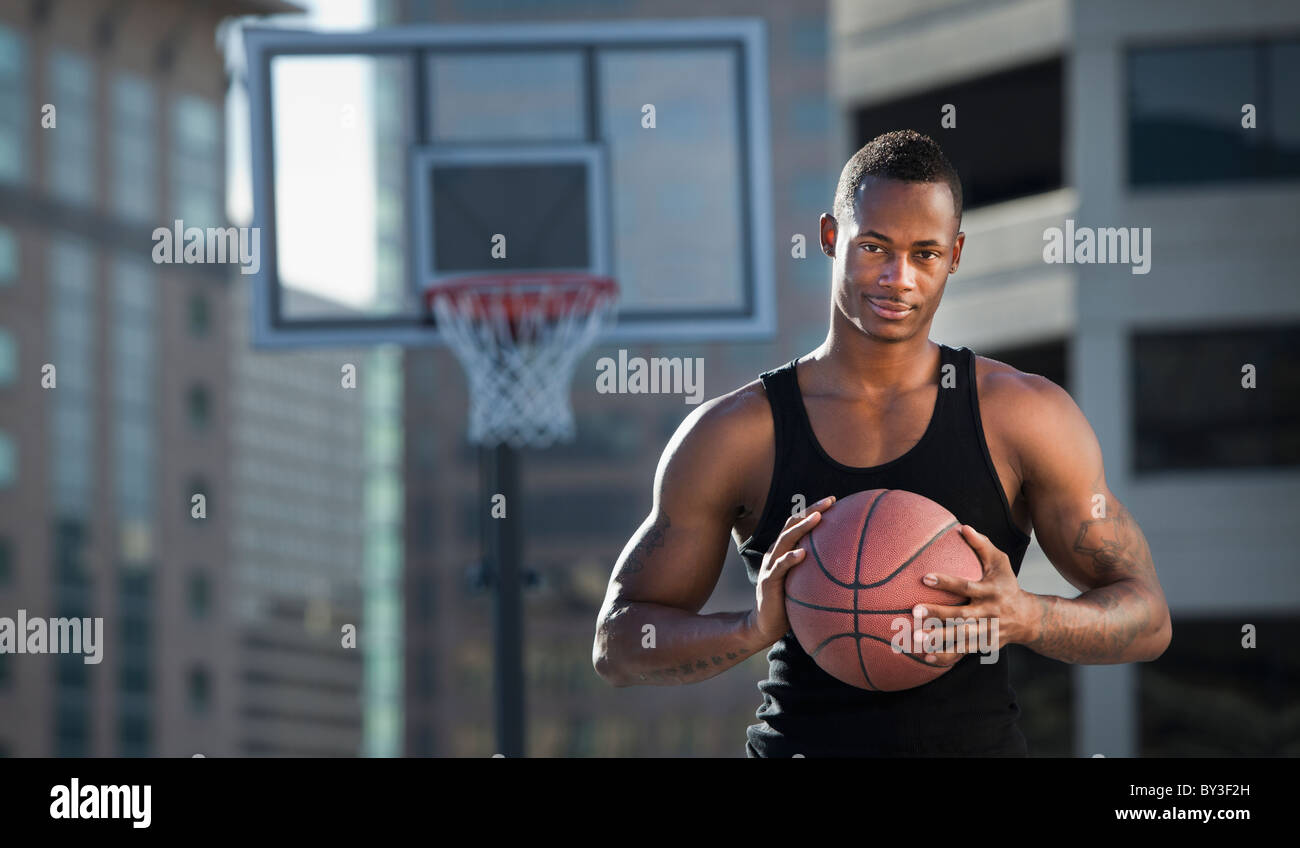 USA, Utah, Salt Lake City, basketball player holding basketball Stock