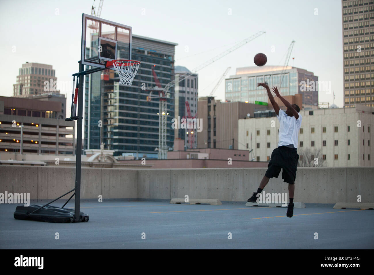 USA, Utah, Salt Lake City, young man playing basketball Stock Photo Alamy