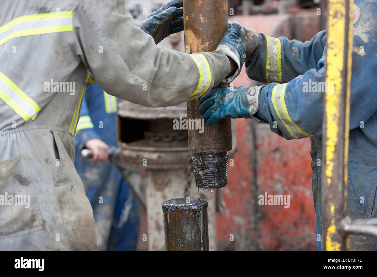 Oil workers drilling for oil on rig Stock Photo
