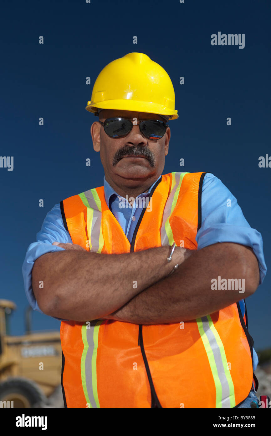 Portrait of construction worker on building site Stock Photo - Alamy