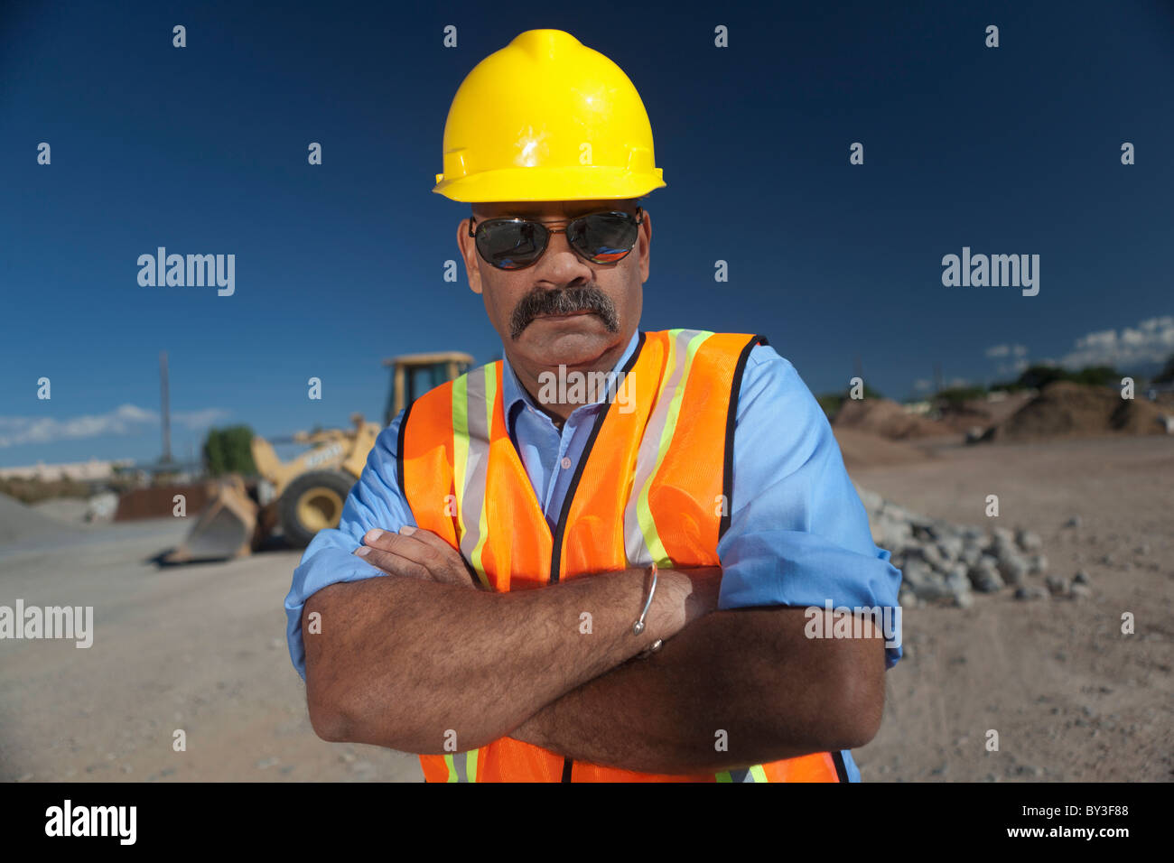 Portrait of construction worker on building site Stock Photo - Alamy