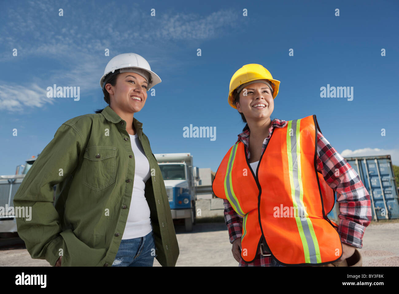 Portrait of two female construction workers on building site Stock Photo