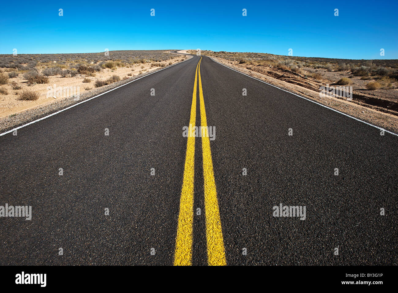 Road through desert Stock Photo