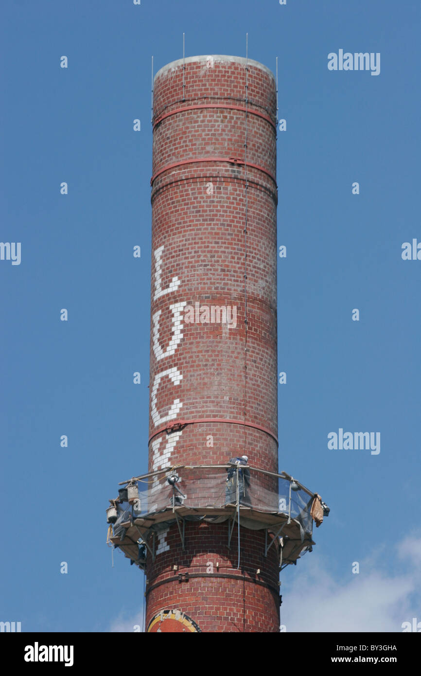 Workers sandblasting and cleaning an industrial brick chimney. Richmond,  Virginia 2010 - Stock Image