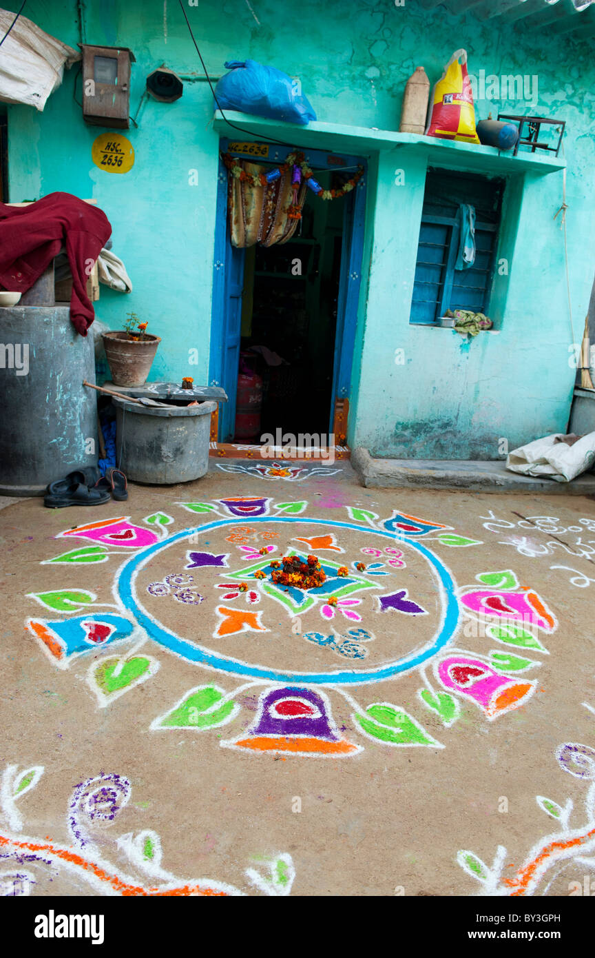 Rular Rangoli Rangoli festival coloured powder design outside rural Indian house in ...