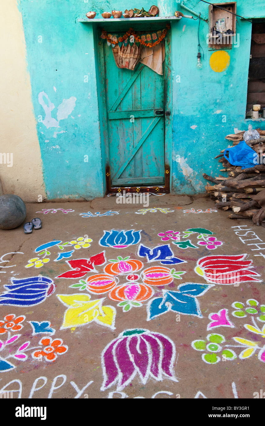 Rular Rangoli Rangoli festival coloured powder design outside rural Indian house in ...