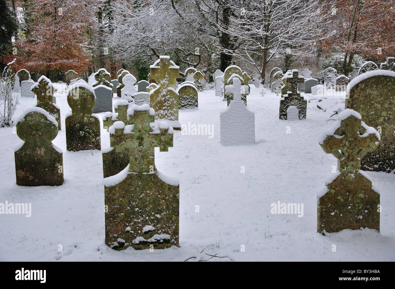 Churchyard with snow covered gravestones after snowfall. Dorset, UK December 2010 Stock Photo