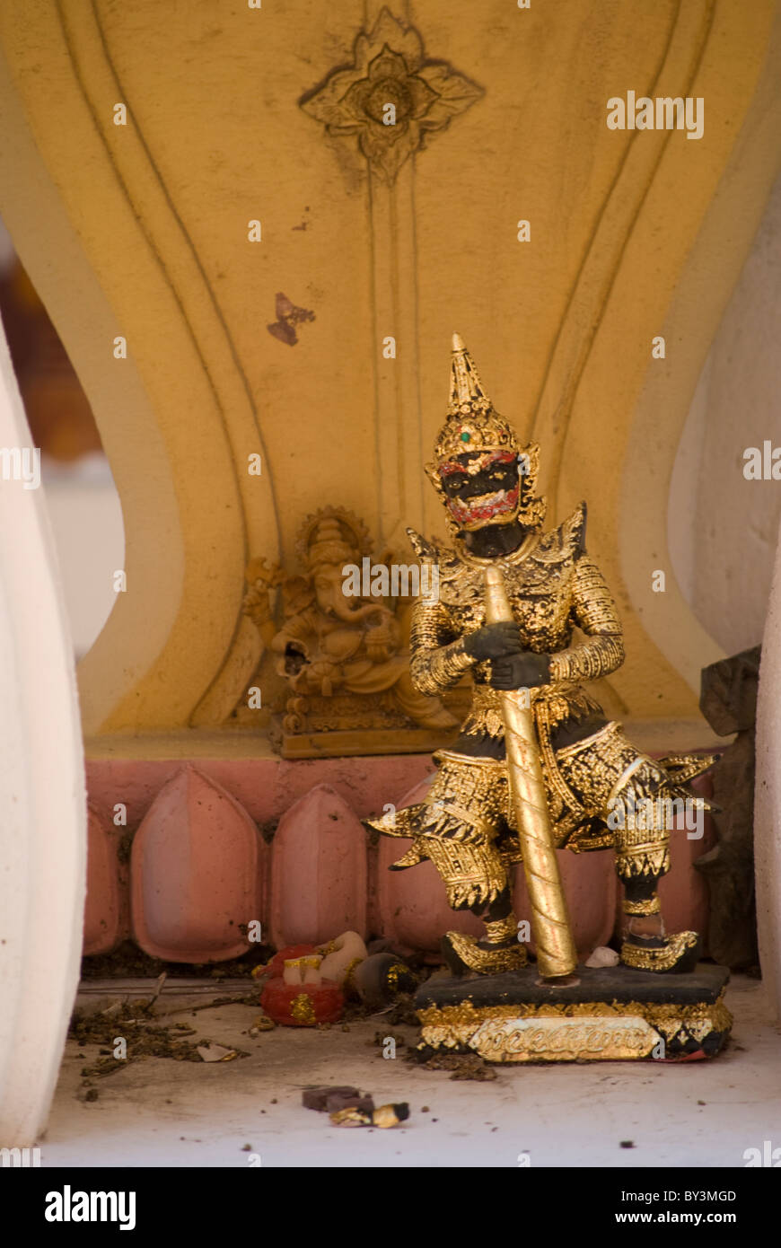 Broken or destroyed holy objects like this mythical figure of yaksha were left in the temple. Stock Photo