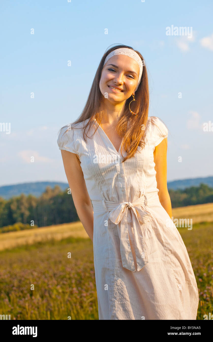 Portrait of a young woman in summer dress Stock Photo - Alamy