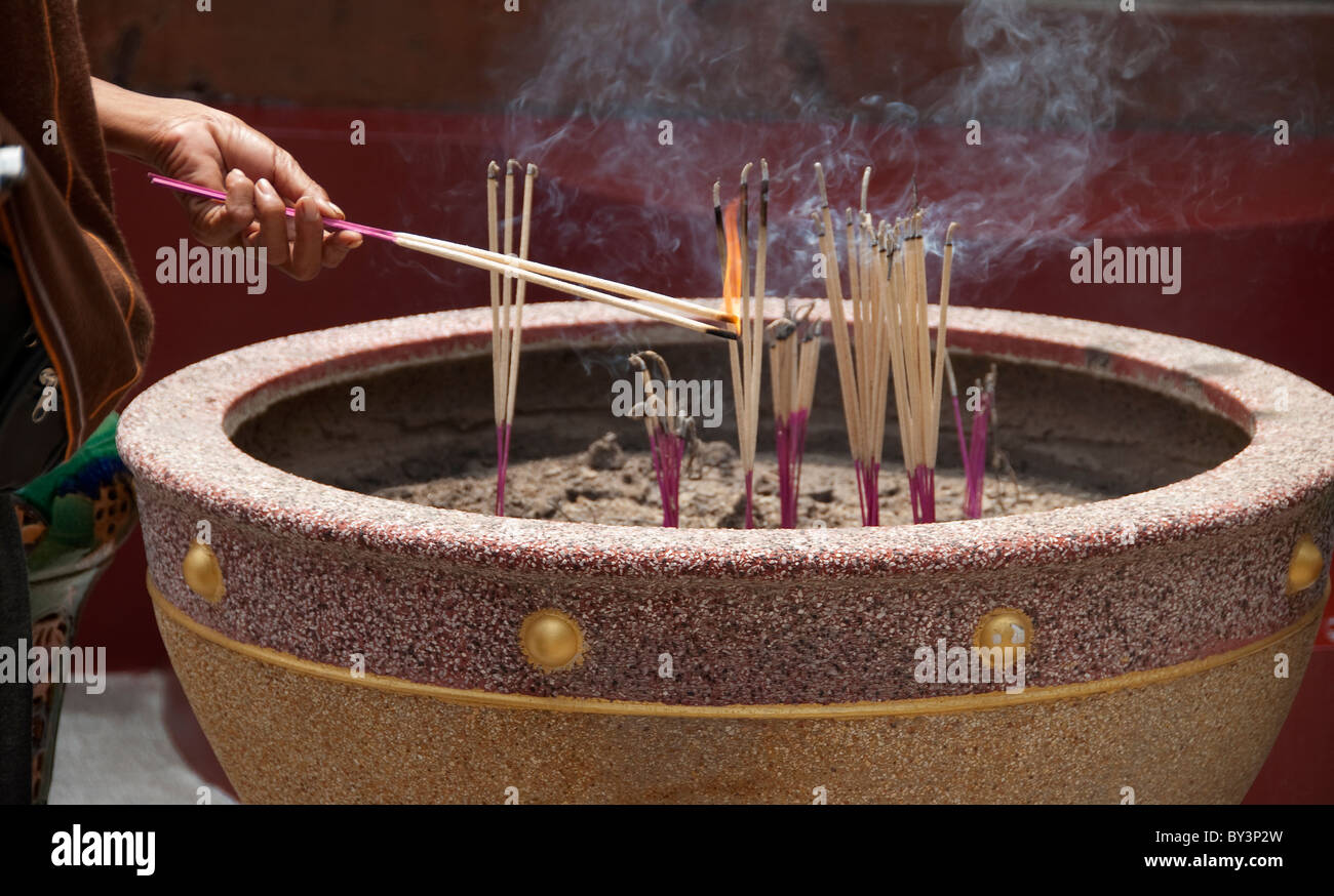 Incense smoke on Bangkok shrine Stock Photo - Alamy