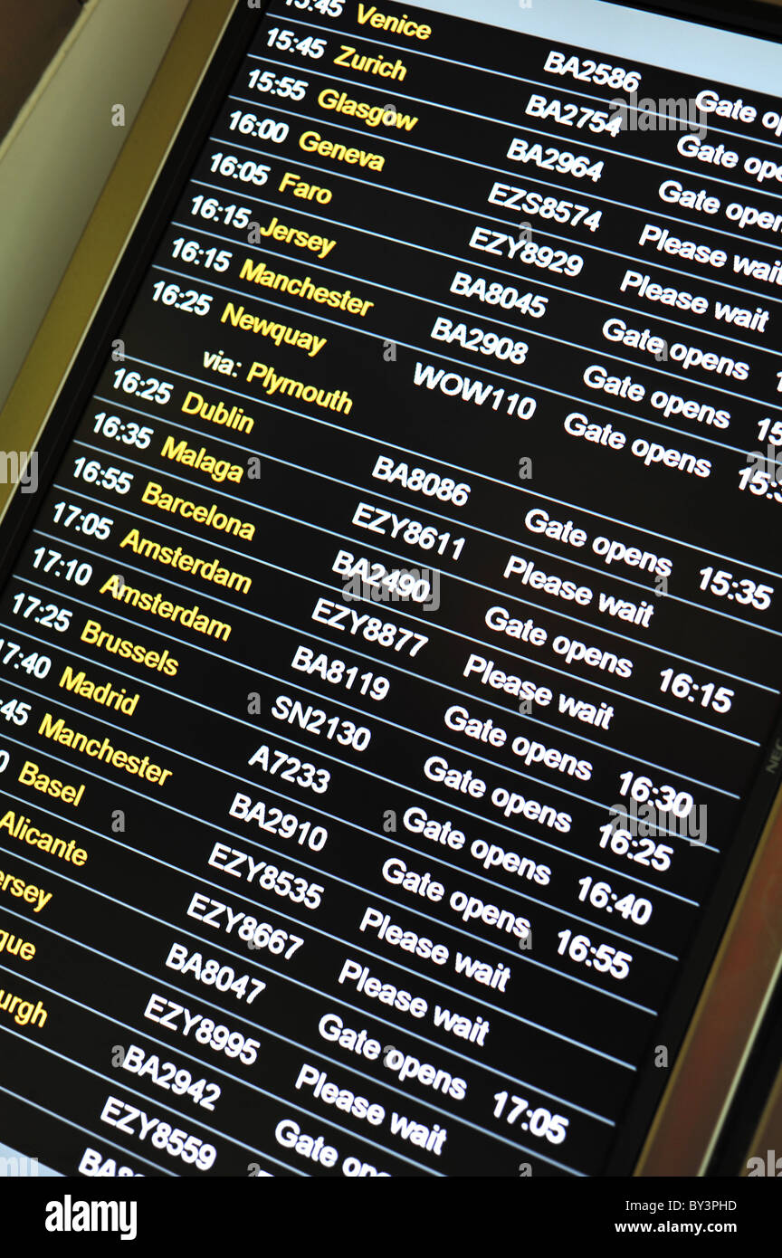 Airport electronic arrivals and departure information board Stock Photo