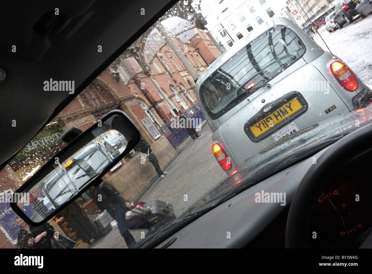 One of (3) images reflecting in set using rear view mirror to capture London Taxis at Marylebone Station. Stock Photo