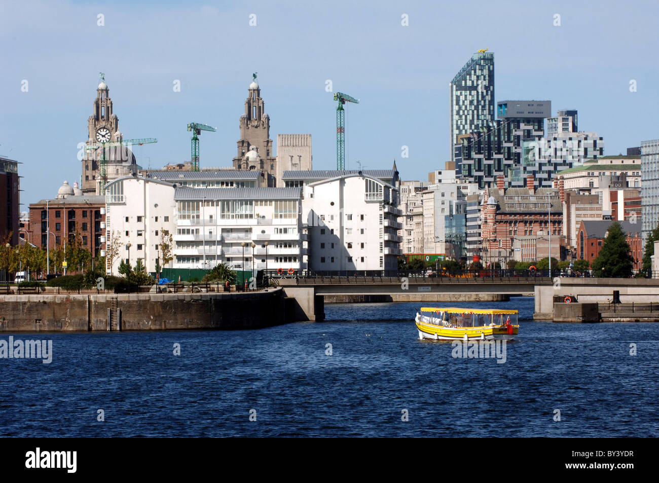 View looking towards Liverpool city centre showing Liver Building, apartments, offices and the docklands. Stock Photo