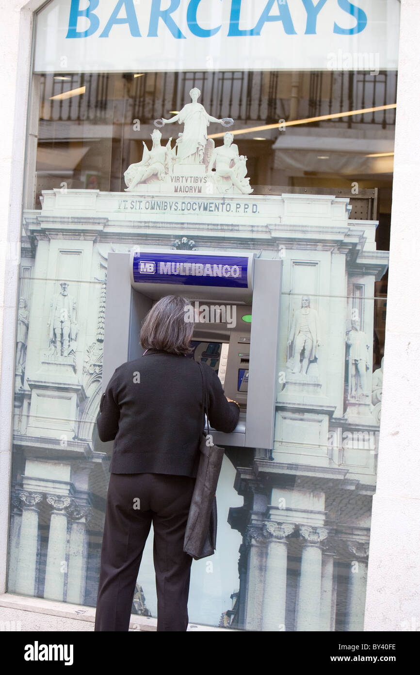 Customer at decorated ATM machine Lisbon Bank Stock Photo
