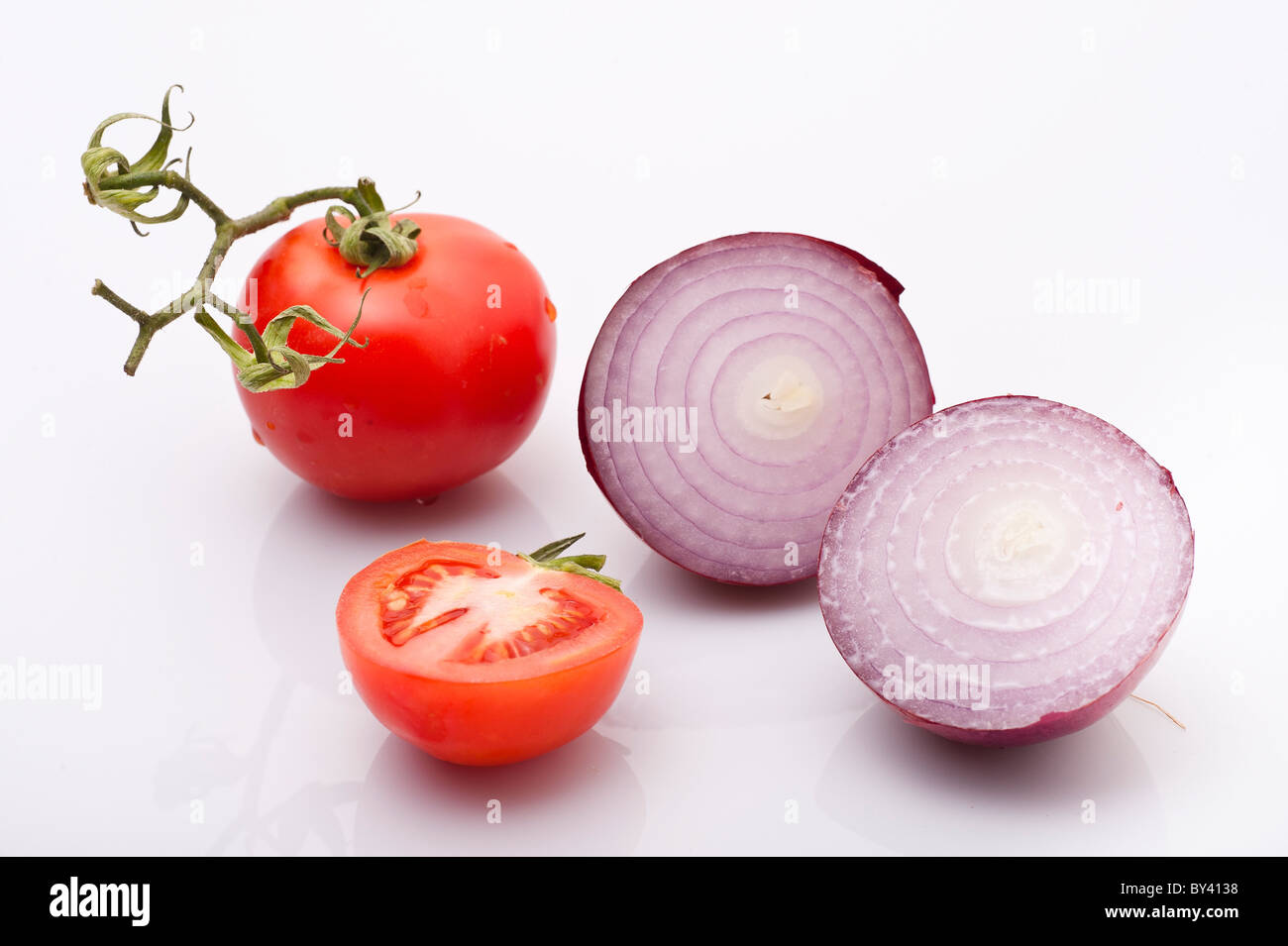 Cut Purple (red) onion and tomatoes on white Background Stock Photo Alamy