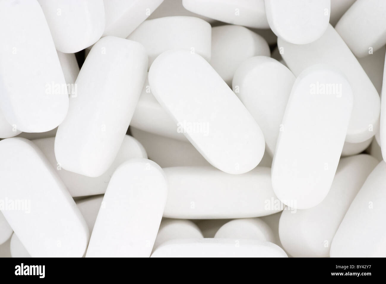 White calcium-magnesium supplement tablets Stock Photo