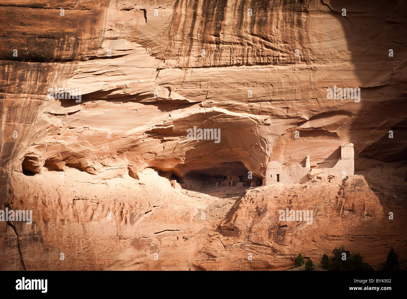 Chinle, Arizona Fall sunlight illuminates the Mummy Cave Ruin deep in
