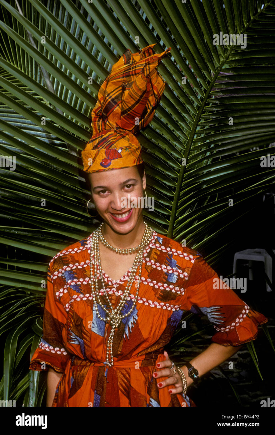1, one, woman, traditional costume, front view, La Plage de Grande Anse, town of Deshaies, Basse-Terre Island, Guadeloupe, French West Indies, France Stock Photo
