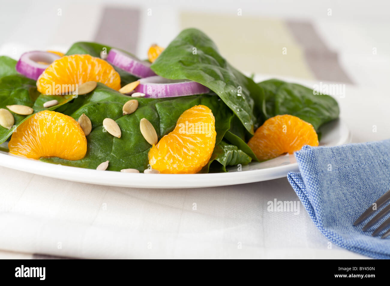 Fresh Spinach with mandarin oranges, red onions and a light orange