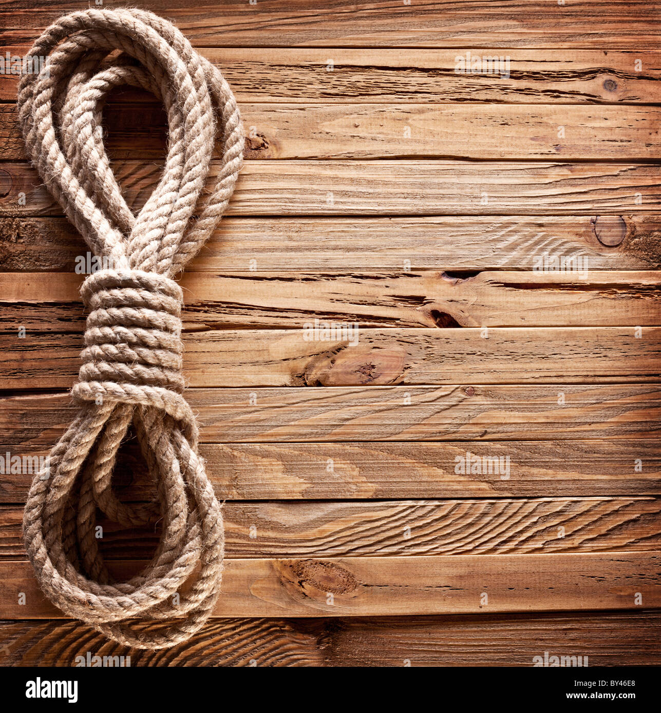 Image of old texture of wooden boards with ship rope. Stock Photo