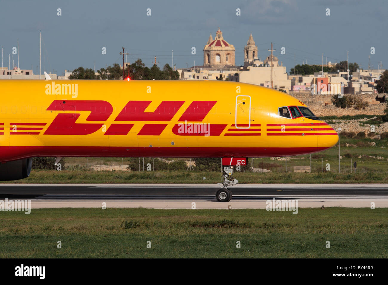 International trade and air freight transport. DHL Boeing 757-200F cargo plane taxiing for departure from the Mediterranean island state of Malta Stock Photo
