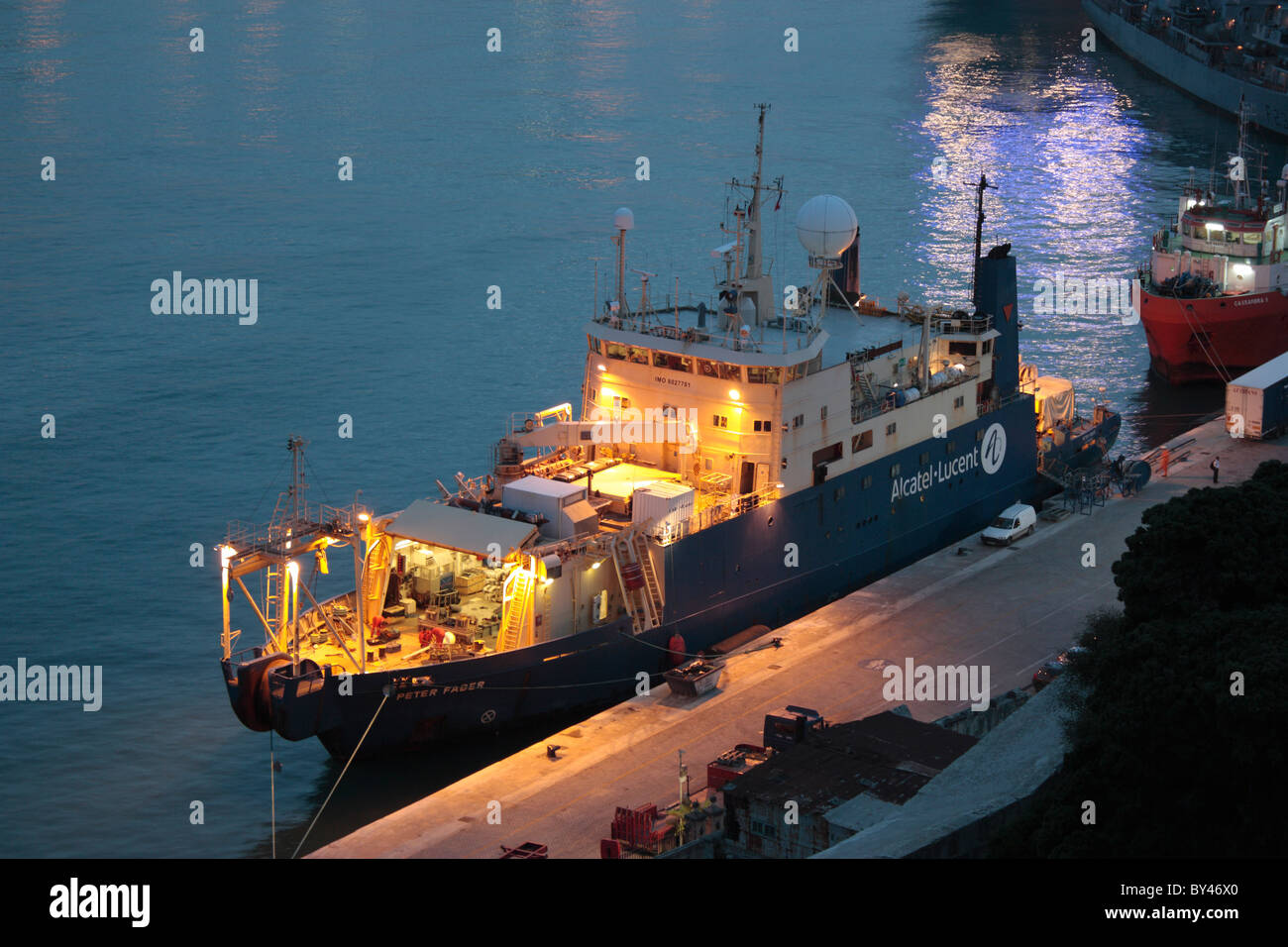 The cable ship Peter Faber at dusk Stock Photo