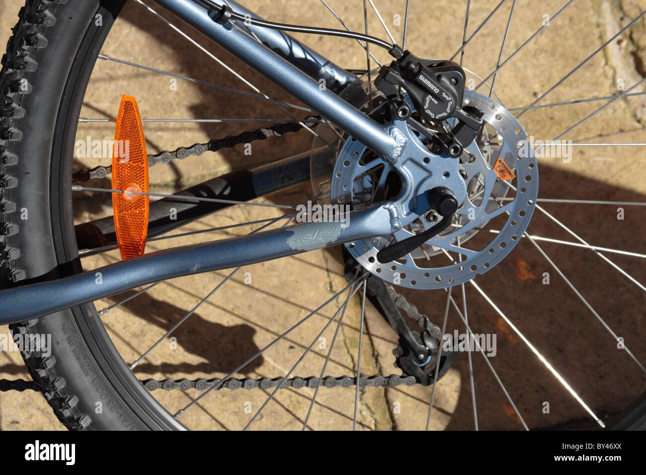 Gear, chain and brake mechanism on the rear wheel hub of a bicycle Stock Photo