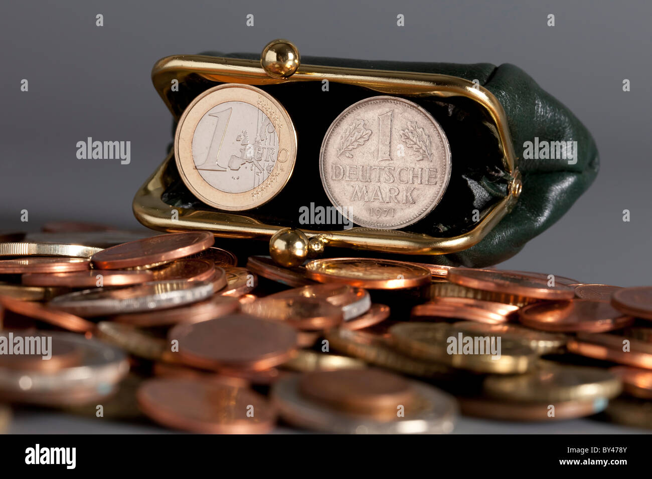 1 Euro coin and an old German 1 Deutsche Mark coin, former and new currency of Germany Stock Photo