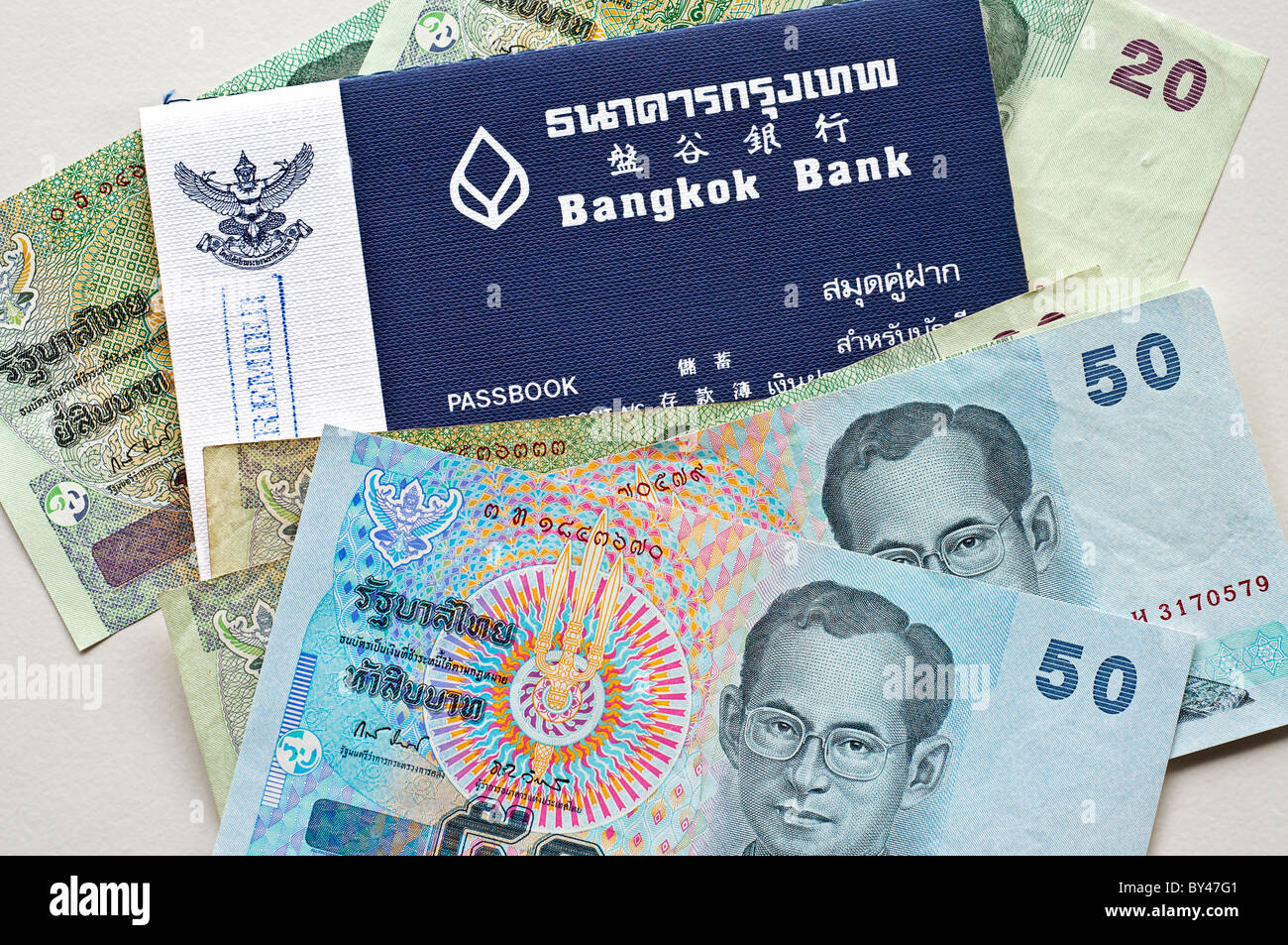 Photo illustration of Thai baht, the currency of Thailand and a Bangkok
