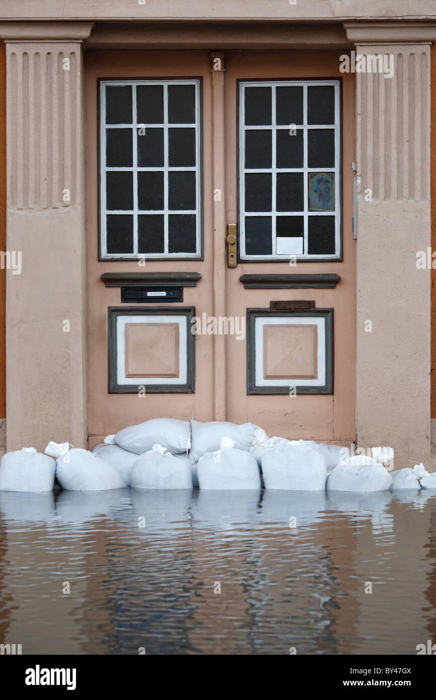 sandbags across the door of a house as protection against flooding of the river Saale in Halle (Germany); January 2011 Stock Photo